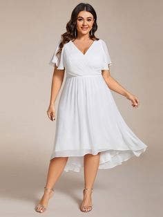 a woman wearing a white dress with short sleeves