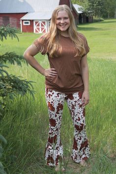 These cow print flares feature an elastic waistband. Model is wearing a size MEDIUM.Model is 5 ft. 3 in. - 125ish lbs. Model typically wears small/medium or 7/27 in bottoms. Denim Jogger Pants, Solid Sweaters, Weekly Outfits, Denim Joggers, Flare Leggings, Single Women, Cow Print, Jogger Pants, Pullover Hoodie