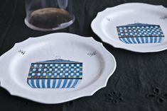 two plates with blue and white designs on them