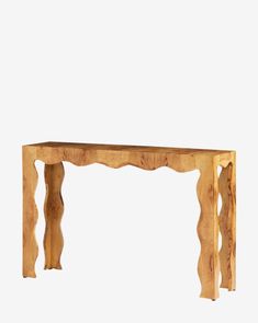 a wooden table with an intricate design on the top and bottom edge, against a white background