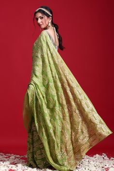 Green saree highlighted with sikkhiya gota patti geometric pattern embroidery. Comes with blouse. 
Component: 2
Embroidered
Sleeve Type: Half
Fabric: Chiffon
Color: Green - Aza Fashions Geometric Pattern Embroidery, Embroidered Saree, Green Saree, Pattern Embroidery, Blouse For Women, Saree With Blouse, Blouse Online, Green Blouse, Aza Fashion