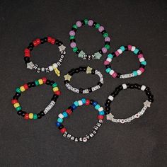 These beaded bracelets are assembled by hand and are inspired by Blink-182 songs and albums. While these are all made to be roughly 7 inches, I can definitely make them smaller/bigger upon request. I'm also willing to make use different songs/albums. Just ask using the personalization tool! :) I made these while I curb my excitement waiting to see Blink-182 this summer. (Featuring the PTV bracelet since they're the opening band.) Ptv Bracelet, Blink 182 Party, Blink 182 Albums, Blink 182 Concert, Bracelets Kandi, Handmade Jewelry Display, Diy Kandi Bracelets, Pony Bead Bracelets