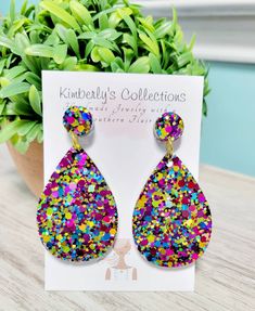 Glitter resin teardrop earrings. Very sparkly in person. Measure 2.25 in from ear. Makes a great gift, will come gift wrapped. Ships free.  Made with stainless steel posts. Trendy Teardrop Earrings For Party, Trendy Hypoallergenic Teardrop Earrings For Gift, Multicolor Teardrop Earrings For Party, Multicolor Teardrop Earrings For Gift, Multicolor Nickel-free Teardrop Earrings For Gifts, Multicolor Hypoallergenic Teardrop Earrings As Gift, Handmade Multicolor Teardrop Earrings For Parties, Glitter Teardrop Earrings As Gift, Glitter Teardrop Earrings For Gifts