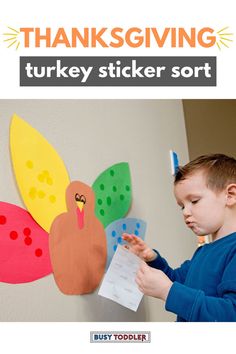 a young boy is making a turkey sticker sort for the thanksgiving turkey craft project