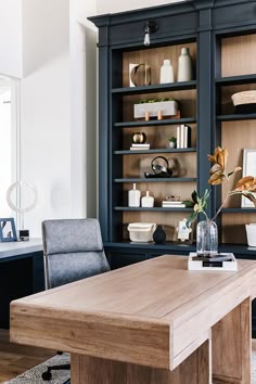 a living room filled with furniture and a book shelf