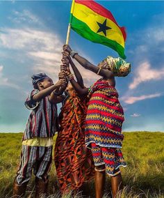 two women holding a flag in their hands