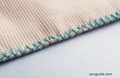 a close up view of a piece of fabric with stitching on it