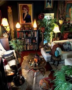 a living room filled with furniture and lots of plants