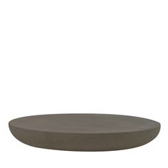 an oval concrete table top on a white background, with the surface painted dark grey