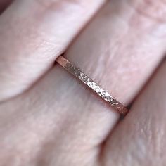 "The textured band on this rustic rose gold ring will dazzle on its own or add dimension to your layering ring stack. This minimalist ring is also available in 14K gold fill, sterling silver and antique silver. Simply choose your size and finish from the drop down menus. {LISTING FEATURES} ~ 14K Rose Gold Fill ~ Rustic ring ~ Raw silk textured band ~ Layering ring ~ Easily stackable with my other ring bands (see below for link to more rings) ~ Can be mixed and matched and stacked with my rings i Promise Rose Gold Midi Rings With Simple Design, Rose Gold Midi Rings With Simple Design For Promise, Rose Gold Promise Midi Rings With Round Band, Rose Gold Midi Rings For Promise, Rose Gold Stackable Rings With Round Band For Promise, Adjustable Rose Gold Stackable Rings For Wedding, Rose Gold Stackable Rings For Anniversary, Rose Gold Stackable Bands For Promise Ring, Rose Gold Stackable Midi Rings For Promise