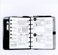 a black and white photo of an open notebook with numbers on the pages, which are numbered in circles