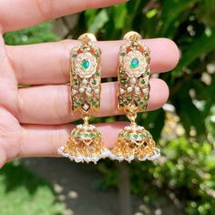 Featuring a traditional dandi jhumki earrings in gold plated silver. It has been set with freshwater pearls and emerald look alike stones. Gold Fusion Jhumkas With Pearl Drop, Elegant Green Chandbali Pearl Earrings, Diwali Pearl Drop Earrings, Gold Plated, Festive Gold-plated Pearl Drop Jhumkas, Pearl Jhumkas, Elegant Gold-plated Meenakari Pearl Earrings, 22k Gold Jewelry Necklaces, 22k Gold Jewelry, Jhumki Earrings