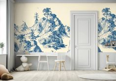 an empty room with blue and white wallpaper