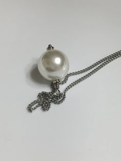 "Available in 15\", 16\", 18, 14mm large single white shell pearl silver stainless steel curb chain necklace. Hypoallergenic . Hand made jewelry! All purchase will arrive in gifts boxes. Thanks for stopping by!" White Pearl Necklace With Chain, Silver Pearl Necklace With Chain Gift, White Round Pendant Necklace For Party, White Ball Chain Necklace Perfect As A Gift, Elegant White Jewelry With Ball Chain, White Pearl Necklace With Silver Chain, Gift White Pearl Necklace With Silver Chain, Elegant White Ball Chain Necklace, Silver Pearl Jewelry With Ball Chain