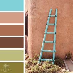 a blue ladder leaning against a wall with color swatches in front of it and below it