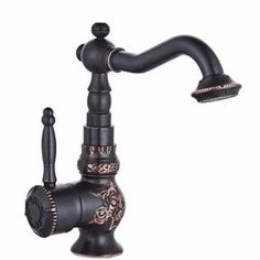 a black faucet with an ornate design on the front and side spout