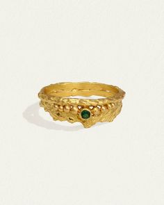 The Verbena Ring is handcrafted from 24k solid gold & natural emerald. Shop unique ring with distinctive rugged silhouette & patterned band. Gold Emerald Ring With Nature-inspired Design, Gold Emerald Ring With Nature-inspired Style, Gold Nature-inspired Round Emerald Ring, Nature-inspired Gold Emerald Ring, Solid Gold Ring, Ring Emerald, Diamond Guide, Crown Jewels, Unique Ring