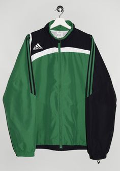 "Adidas Track Jacket - Size tag: Please always check measurements before buying. Men's L - Measurements (laying flat): Pit to Pit: 24.5\" Length: 28.5\" Pit to Cuff: 22.5\" -Wear: /Please see images for details/ Overall in good used condition. The cuffs are stretched out. Small dots/stains on the back and two small ones at front as shown on the pictures. - Fabric: 100% Polyester *All of our items are preloved pieces so some signs of natural wear and age are to be expected. Please look through the photos carefully to check if the condition is to your satisfaction. *All efforts are made to show any defects however small imperfections may be missed. *We try to describe the sizes as accurately as possible, but please keep in mind that sizes nowadays can differ to sizes used back then. Please n Sports Track Jacket With Side Stripes, Athleisure Outerwear For Sports Events With Three Stripes, Athleisure Outerwear With Three Stripes For Sports, Three Stripes Sportswear Outerwear For Training, Sportswear Outerwear With Three Stripes For Training, Sports Outerwear With Side Stripes, Sportswear Windbreaker With Three Stripes, Sportswear Track Jacket With Contrast Stripes, Sporty Track Jacket With Contrast Stripes For Winter