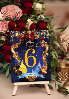 a birthday card with the number six on it next to some flowers and other decorations