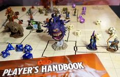 a board game with dice and monsters on it