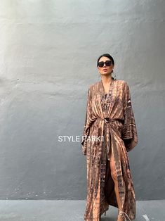 Bali Tie dyed Kimono long jacket,  It's made by the Bali's traditional  Tie dyed  If you are very small this may be too big.  Matching bag and belt are included  Stylepark1 Model  -Her height is 175Cm/5.74ft weight is 57kg/126lb /American size, she wore  ~ M  size.  Made from soft Rayon   Hand cool wash  Material shrinkage will occur when dried in a tumble dryer. At first, you may smell the unique dye. It will disappear after you wash it. So do not worry. Color : Bali   tie dyed -Toasted amind b Long Kimono Outfit Dressy, Brown Long Kimono For Festival, Bohemian Long Tie Dye Kimono, Silk Long-sleeved Kimono For Vacation, Long Kimono Outfit, Long Kimono Dress, Festival Tie-dye Kimono With Kimono Sleeves, Bohemian Long Tie-dye Kimono, Kimono Outfit