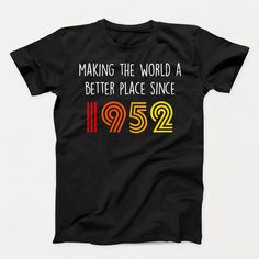 a black t - shirt with the words making the world a better place since in it