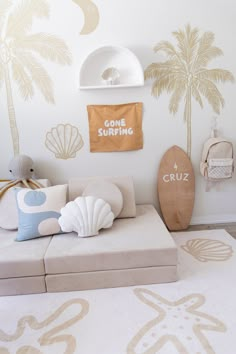 a living room filled with furniture and wallpaper covered in palm tree decals on the walls