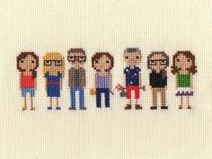 cross stitch people are standing in a row