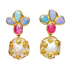 Step into a world of elegance with these stunning earrings, showcasing the iridescent charm of Australian Opals and the unique allure of Baroque Pearls. Accented with the rich hue of Rubies and the playful brilliance of Multicolor Sapphires, these earrings are a testament to timeless sophistication. Metal: 18K Gold over Sterling Silver. Stones: Australian Opal, Baroque Pearl, Ruby, Multicolor Sapphires Color: Aqua, Turquoise, Red, Yellow, Green, Pink, White, Gold Length: 45mm Luxury Multi-stone Teardrop Earrings, Luxury Multi-stone Earrings Gift, Luxury Multi-stone Earrings As Gift, Luxury Multi-stone Earrings For Gift, Luxury Teardrop Multi-stone Earrings, Elegant Multicolor Pearl Earrings For Celebration, Luxury Baroque Party Earrings, Multicolor Pearl Drop Earrings, Elegant Multicolor Dangle Pearl Earrings