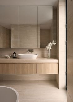 a bathroom with a sink and mirror in it