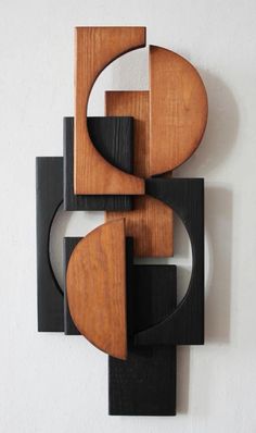 an abstract wooden sculpture on the wall