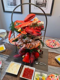 a table with lobsters and other food on it