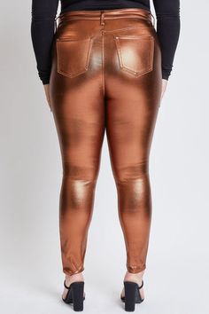 All that glitters is golden in our new Junior Plus High Rise Metallic Skinny Jean. These high-waisted pants are coated for a shimmering effect and feature a vibrant color, making them perfect for that Holiday Glam 'fit. With the look of jeans and the stretch of leggings, this pant is comfortable for all-day (or all-nig Gold Shiny Bottoms For Night Out, Glamorous Shiny Gold Bottoms, Fitted Shiny Gold Bottoms, Gold Stretch Shiny Bottoms, Fitted Metallic Sheen Pants, Glamorous Gold Stretch Bottoms, Shiny Metallic Leggings For Party, Glamorous Metallic Stretch Bottoms, Metallic Shiny Leggings For Party