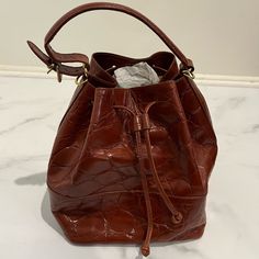 Nwt - Never Used. Tag & Authenticity Card Included. In Excellent Condition. Inside Material Shows Some Age. Purse Is From About The 70’s/80’s. Details: Color: Rust Brown Made In Italy 100% Genuine Leather - Large Pebble Design Handbag (Adjustable Hand Strap) Or Crossbody (Shoulder Strap Is Attachable). Square Base Pull String Closure 1 Zipper Pocket Inside Vintage Cognac Shoulder Bag For Shopping, Classic Brown Bucket Shaped Bag, Classic Formal Brown Bucket Bag, Vintage Everyday Bucket Bag, Formal Brown Bucket Bag, Vintage Brown Bucket Bag With Detachable Strap, Brown Bucket-shaped Formal Bag, Formal Brown Bucket Bag As Shoulder Bag, Brown Formal Bucket-shaped Bag