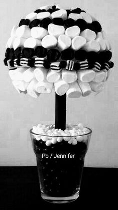 a black and white photo of marshmallows in a vase