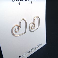 I've handcrafted these heart earrings out of sterling silver. These are fun and versatile, great to wear every day. Earrings are approximately 1.2 cm x 1.4 cm wide. Since I make these shapes completely by hand, there may be slight variations. See more~ Post earrings- http://www.etsy.com/shop/aubepine?section_id=6718986 Silver earrings- http://www.etsy.com/shop/aubepine?section_id=6718998 The rest of my jewelry shop- http://aubepine.etsy.com/ Jewelry Heart, Love Jewelry, Diy Wire Jewelry, Ear Rings, Green Quartz, Moonstone Necklace, Quartz Earrings, Sterling Silver Hoops, Heart Jewelry