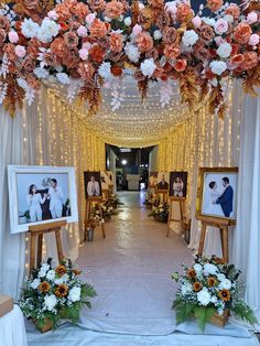 an aisle decorated with flowers and pictures