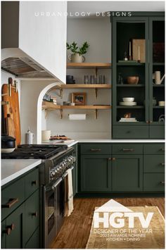 a kitchen with green cabinets and white walls, wood flooring and open shelving