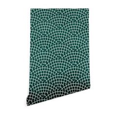 a green and white wallpaper with an intricate design on it's side,