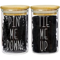 two jars with writing on them that say, pen me up and tie me down