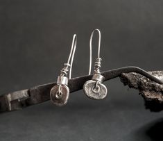 Silver rustic earrings Organic silver dangle Silver handmade Dangle drop earrings Oxidized silver Rustic sterling silver Jewelry brutalist The earrings made to order! --------------------------------------- If you have any questions, please fell free to ask me! ----------------------------------------------------------------------------- The technique of earrings is the melting and hammered of silver. That's why every jewelry will be unique. Polished and oxidized. That's why every jewelry will b Rustic Silver Jewelry, Rustic Hand Forged Silver Earrings, Rustic Sterling Silver Earrings, Rustic Sterling Silver Dangle Earrings, Rustic Silver Dangle Earrings, Brutalist Earrings, Oxidized Silver Bracelet, Silversmithing Jewelry, Art Jewelry Earrings