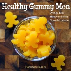 orange gummy men on a cutting board with the words orange gummy men above it