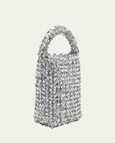 Bottega Veneta "Cabat" intreccio metallic leather bucket bag with sequins leather     Top handle     Open top     Interior, leashed zip pouch bag     Approx. 10.2"H x 8.3"W x 5.1"D    Made in Italy Silver Pouch Bucket Bag For Evening, Silver Bucket Bag For Evening, Party Bucket Bag With Silver-tone Hardware, Silver Bucket Bag With Silver-tone Hardware For Evening, Silver Bucket Evening Bag, Party Bucket Bag With Top Carry Handle, Silver Bucket Bag With Silver-tone Hardware, Evening Bucket Shoulder Bag With Intrecciato Weave, Evening Woven Leather Bucket Bag Tote