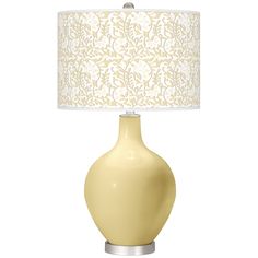 a yellow table lamp with a white shade on the base and a light green flowered lampshade