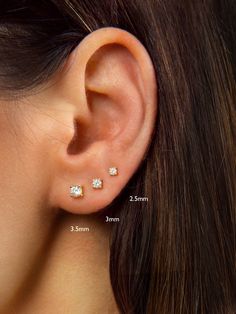 "A must-have in any jewelry collection, these dainty studs look beautiful with everything. Faceted round brilliant cubic zirconia hand-set in a high quality 4-prong setting. Discreet and undeniably classic, these are the perfect everyday stud earrings. ♦ SOLD AS A PAIR ♦ Size: Choose between 2.5mm, 3mm and 3.5mm at checkout. * D E T A I L S * ∙ Material: .925 Sterling Silver or 18K Gold Plated over .925 Sterling Silver ∙ Stone: White Zirconia ∙ Dimensions: 2.5mm or 3mm or 3.5mm ∙ Hypoallergenic First Earrings Studs, Double Lobe Piercing Studs, Seconds Ear Piercing Gold, Double Ear Piercings Studs, Tiny Diamond Stud Earrings, Diamond Earrings Minimal, Diamond Second Stud Earrings, Double Ear Piercing Earrings, Second Earlobe Piercing