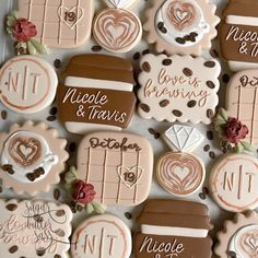 decorated cookies are arranged in the shape of heart doors and windows with names on them