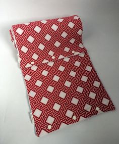 a red and white cloth with squares on it