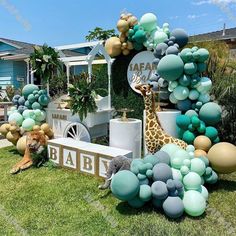 a giraffe and zebra themed baby shower with balloons