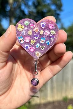 "Super cute heart shaped purple glitter with paw prints and animals retractable badge reel. Heart measures 2\" across. Badge reel has an alligator clip." Novelty Multicolor Badge Reel For Hobby, Affordable Personalized Purple Badge Reel, Novelty Pink Badge Reel, Customizable Multicolor Novelty Badge Reel, Customizable Novelty Multicolor Badge Reel, Respiratory Therapist, Nurse Badge Reel, Nurse Badge, Retractable Badge Reel