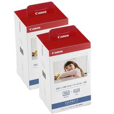 two boxes of canon photo paper are shown in this image, one is red and the other is white